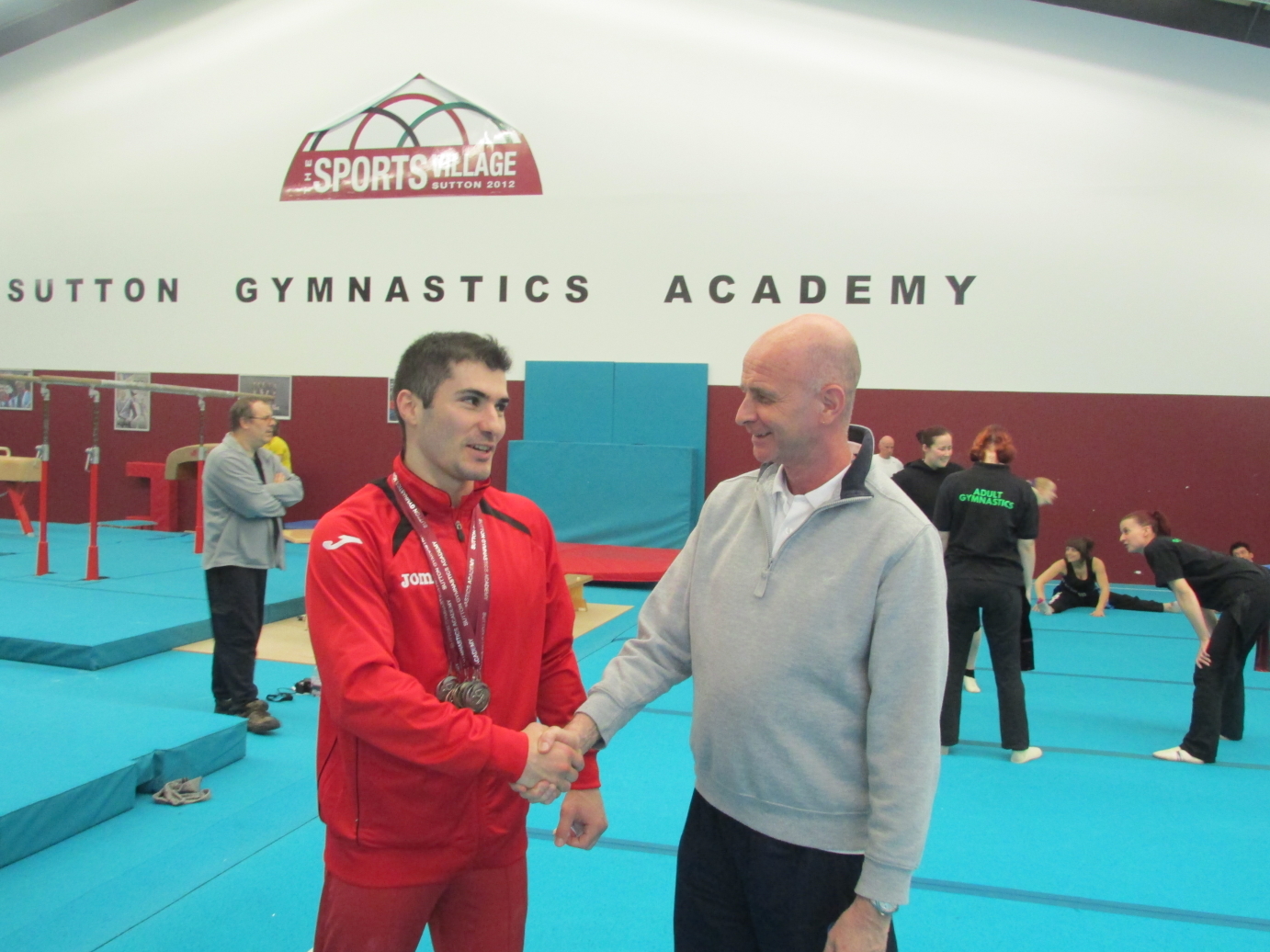 Stef with coach Maurice at Sutton Gymnastics Academy