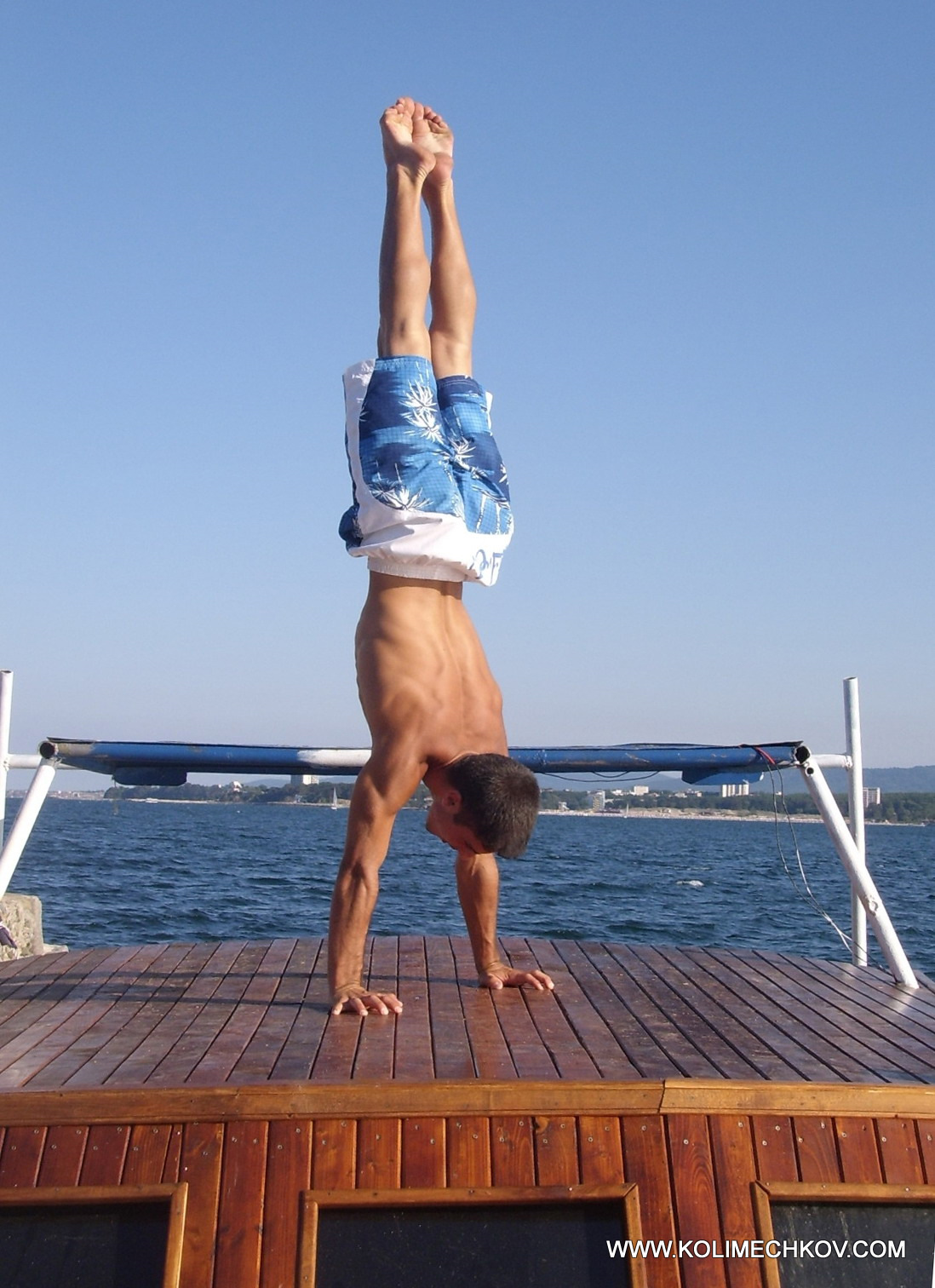 Handstand on the top of a boat